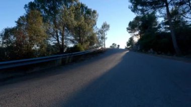 Man drifting riding a longboard on sunset in a road. Skateboard Longboarding 4k