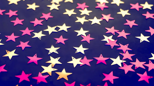 Weihnachten Hintergrund mit farbigen verschwommenen Sterne Konfetti — Stockfoto
