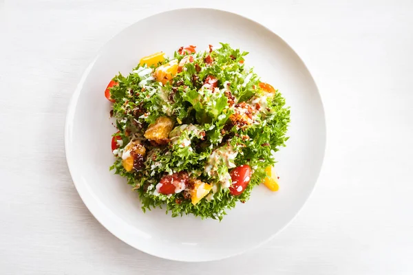 Fresh vegetable salad on white plate. Healthy food concept.