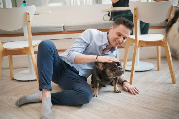 Young Man Hugging His Dog Lying Floor — Stock Photo, Image