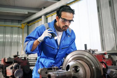 Worker changing and repair part of wheels at the car service