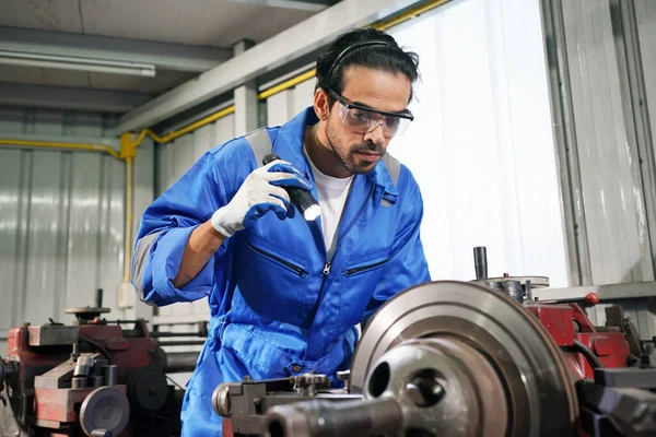 Worker changing and repair part of wheels at the car service