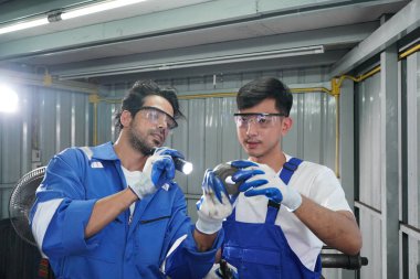 Workers changing and repair part of wheels at the car service