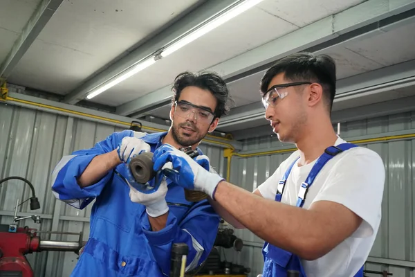 Workers changing and repair part of wheels at the car service