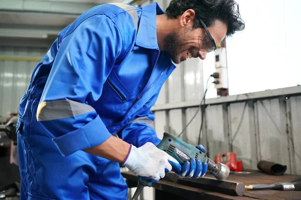 Worker changing and repair part of wheels at the car service
