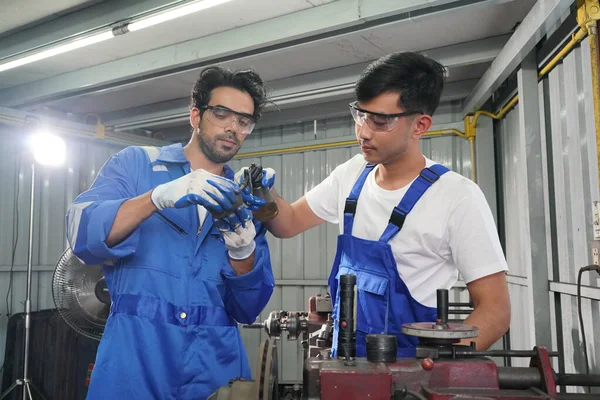 Workers changing and repair part of wheels at the car service