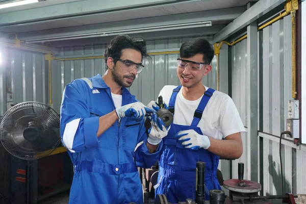 Workers changing and repair part of wheels at the car service