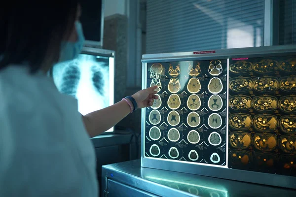 doctors looking at some lab results on monitors, in an office at the hospital.