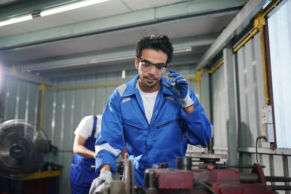 Worker changing and repair part of wheels at the car service