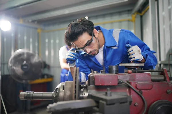Worker changing and repair part of wheels at the car service