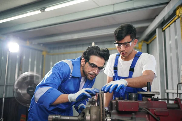 Workers changing and repair part of wheels at the car service