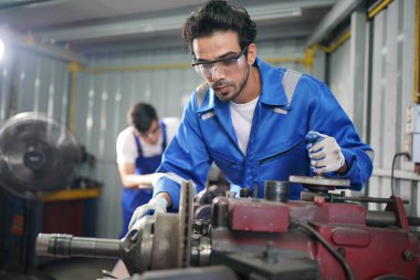 Workers changing and repair part of wheels at the car service