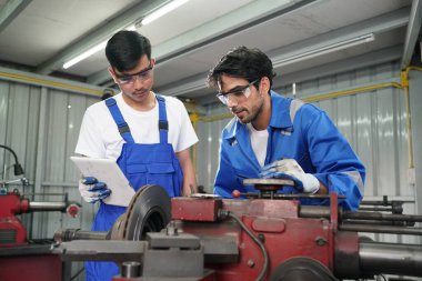 Workers changing and repair part of wheels at the car service