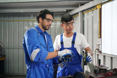 Workers changing and repair part of wheels at the car service