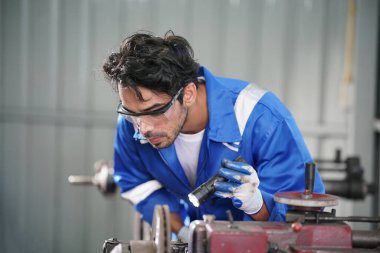 Workers changing and repair part of wheels at the car service