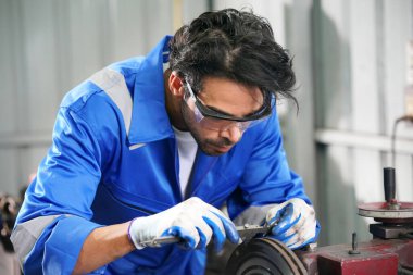 Workers changing and repair part of wheels at the car service