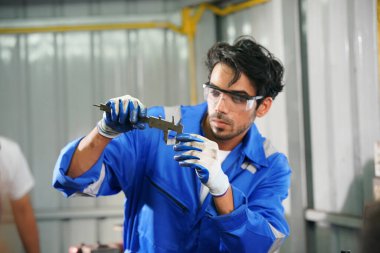 Worker changing and repair part of wheels at the car service