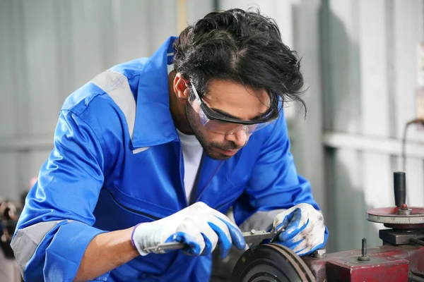 Workers changing and repair part of wheels at the car service