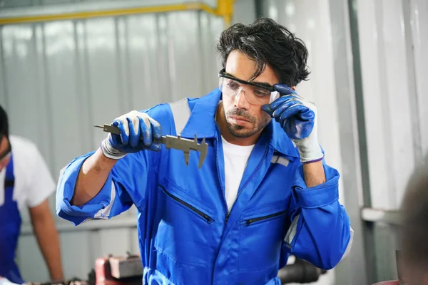Workers changing and repair part of wheels at the car service