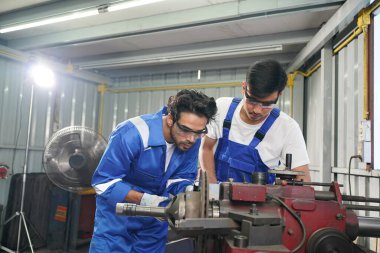Workers changing and repair part of wheels at the car service