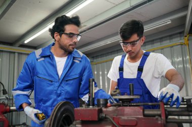 Workers changing and repair part of wheels at the car service