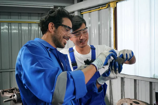 Workers changing and repair part of wheels at the car service
