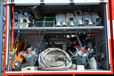 Part of equipment of a firetruck: hoses, valves and syringe of a water cannon.