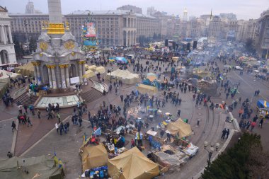 View of Majdan Nezalezhnosti the center of Kyiv, protesters tent city and crowd of people walking around. Revolution of Dignity