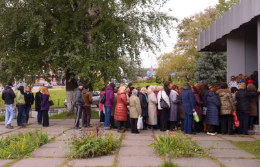 People standing in a queue to get to Dovzhenko movie studio. June 15, 2019. Kyiv, Ukraine