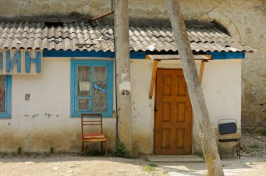 Building and main entrance to the old village store. June 29, 2013. Shyrokoe village, Crimea