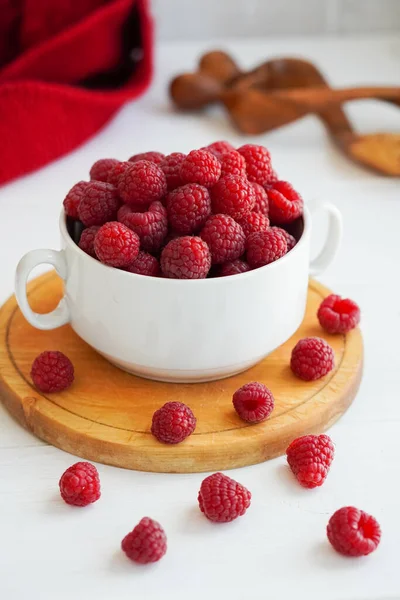 A few fresh ripe raspberries on wooden table — Stock Photo, Image