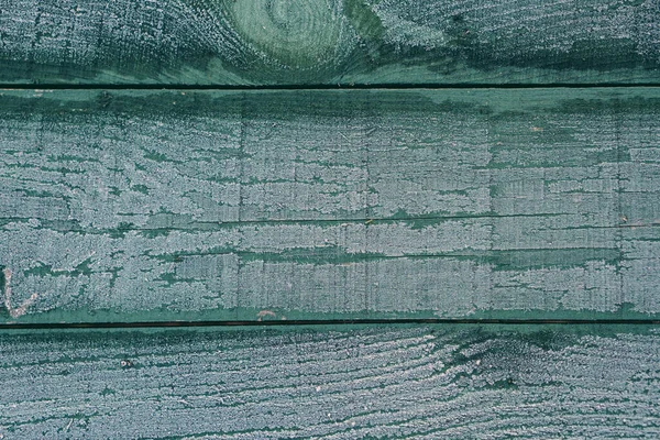 Fondo de madera horizontal marrones cubiertas con copos de nieve — Foto de Stock