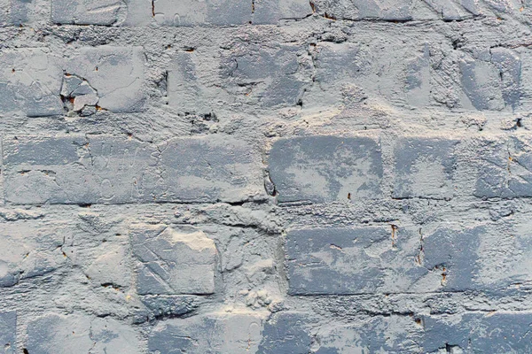 Doğrusal olmayan eski püskü tuğla duvar desenleri doğal boya desenleri ile. Gri tuğla duvar arkaplanı