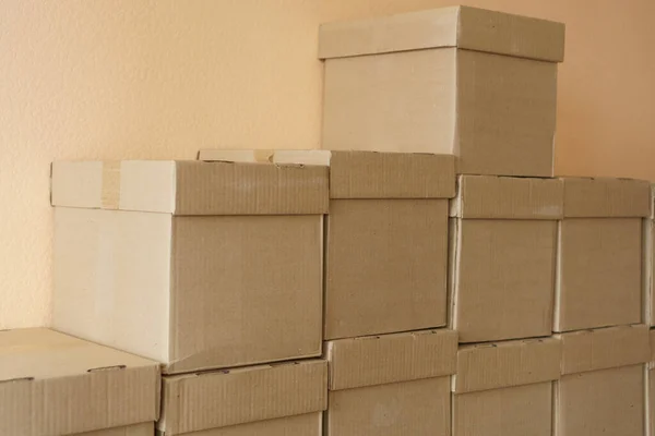 Set of cardboard brown boxes in storehouse. Background of carton boxes in wsrehouse