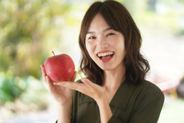 Female with an apple 