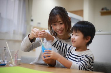Parent and child making slime 