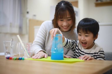 Parent and child making slime 