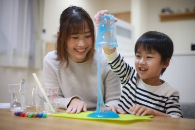 Parent and child making slime 