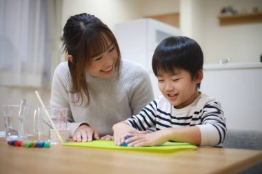 Parent and child making slime 