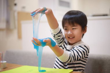 Image of a boy making slime 