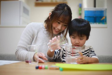 Parent and child making slime 
