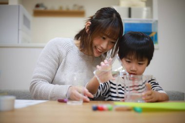 Parent and child making slime 