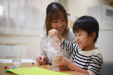 Parent and child making slime 