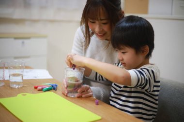 Parent and child making slime 