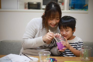 Parent and child making slime 