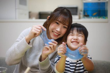 Parent and child making slime 