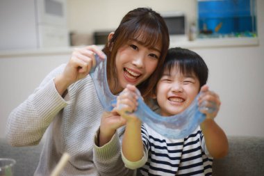 Parent and child making slime 