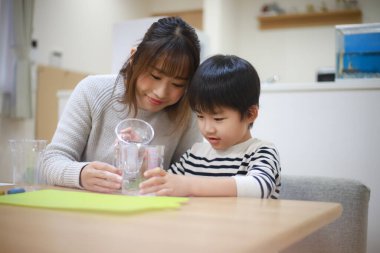 Parent and child making slime 