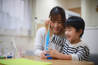 Parent and child making slime 