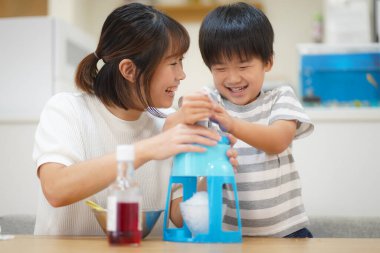 Parents and children making shaved ice 